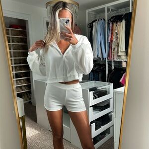 White shorts, bralette and zip up matching set